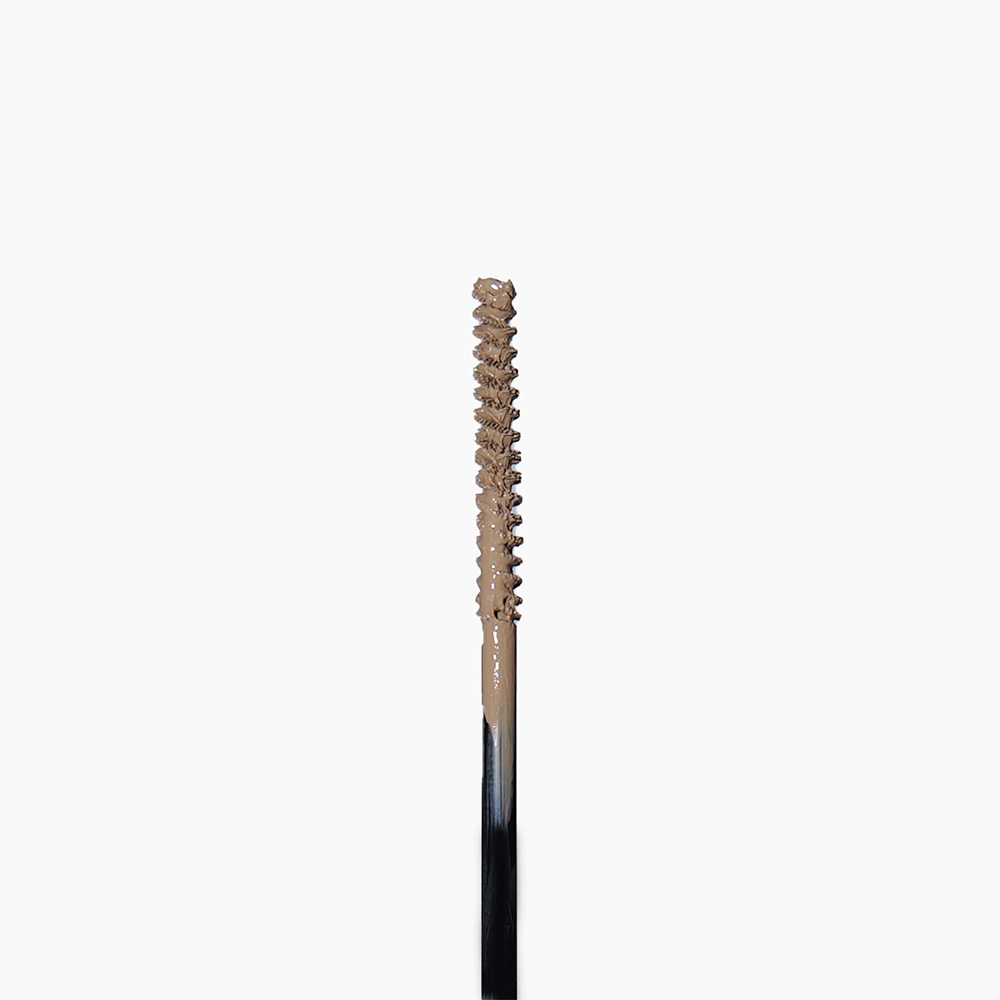 The brow ink brush shows the blond color