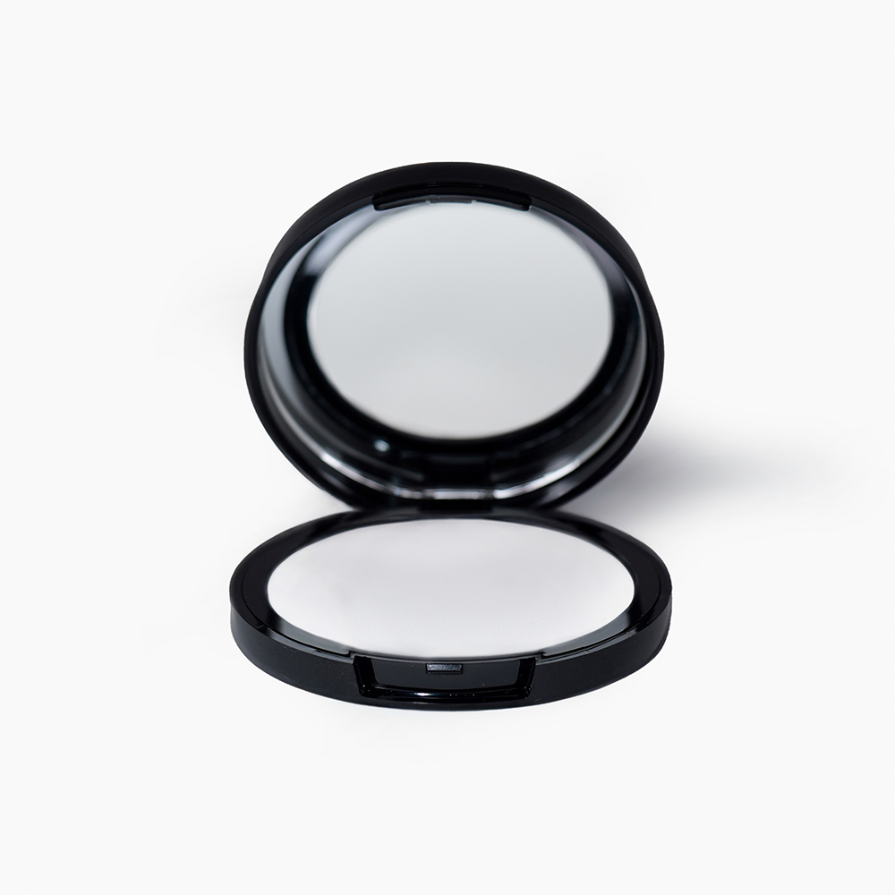 a photo of a pla essentials invisible compact powder