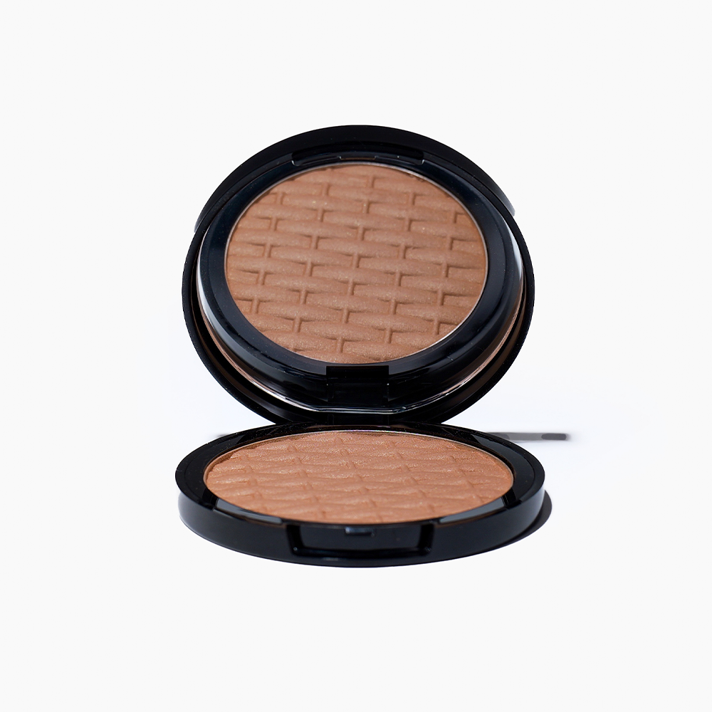 Photograph of an open front Mineral Sheer Bronzer compact powder from the brand Pla Essentials